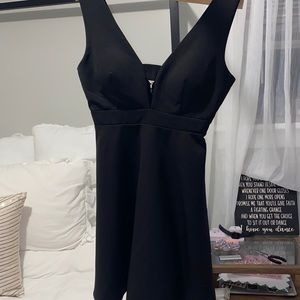 A lined cutout black dress